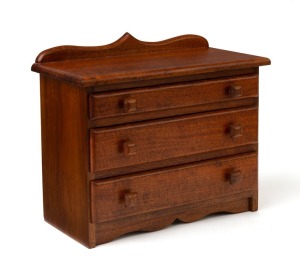 A miniature blackwood three drawer chest together with an inlaid Queensland maple glove box, 20th century, the chest 23cm high, 27cm wide, 14cm deep