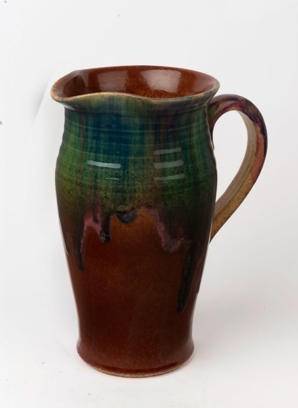 P.P.P. (PREMIER POTTERY PRESTON) tall water jug with unusual brown, green and blue glaze with pink highlights, stamped "P.P.P." and incised "133", 24cm high