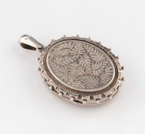 A large antique English sterling silver locket with engraved fern motif, circa 1882, 6cm high overall,