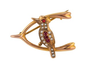 DUGGIN SHAPPERE & Co. Melbourne, 9ct gold kookaburra and wishbone brooch set with seed pearls and rubies, circa 1900, 3.5cm wide, 2.5 grams