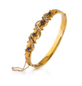 WILLIS & SONS of Melbourne fine antique 15ct yellow gold bangle encrusted with sapphires and seed pearls, late 19th century, stamped "15" flanked by pictorial marks, 6.4cm wide, 10.5 grams total