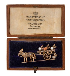 AUGUST BRUNKHORST of Adelaide, antique 15ct gold "Donkey & Cart" brooch set with seed pearls, coral, and ruby", circa 1910. 5cm wide, 7.4 grams total