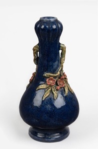 ARTIST UNKNOWN blue glazed pottery vase with applied floral decoration, 31cm high