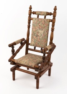 A miniature Australian blackwood platform rocking chair with floral tapestry upholstery, late 19th century, 58cm high, 30cm across the arms