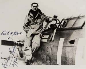 DOUGLAS BADER - BRITISH WWII FIGHTER ACE: printed photographic image (20x25cm) of Bader standing on the wing of his Hurricane, boldly signed in ink “Good Luck Robert, Douglas Bader, 14/7/80”. Bader was befriended by German ace Adolf Galland (see lot 919)