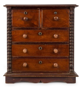 A Colonial antique apprentice chest of five drawers, cedar and pine with half bobbin turned columns and moustache plinth, South Australian origin, 19th century, ​​​​​​​55cm high, 50cm wide, 27cm deep