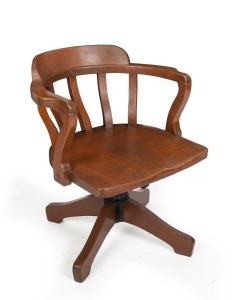 An antique Australian revolving office chair, solid silky oak, Queensland origin, circa 1900, 62cm across the arms