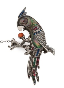 Austro-Hungarian cockatoo brooch, silver and paua shell encrusted with rubies, sapphires, seed pearls and coral, early 20th century, 6.5cm high