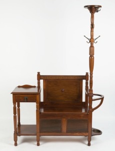 An Australian blackwood Tudor revival hallstand, circa 1925, unusual configuration with single drawer, lift-top seat, hat tree and umbrella stand, ​​​​​​​180cm high, 128cm high, 40cm deep