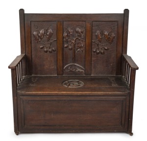 ROBERT PRENZEL (attributed) Australian carved timber hall seat with lift-top storage base impressively carved with gumnuts and leaves, early 20th century, 123cm high, 115cm wide, 55cm deep