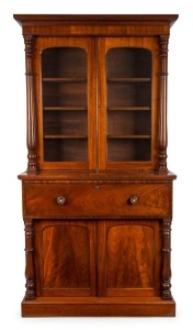 A Colonial Australian cedar secretaire bookcase with full turned columns, cock-beading, flame cedar panels, full cedar fitted interior and secondary timbers, New South Wales origin, circa 1855, 234cm high, 127cm wide,54cm deep