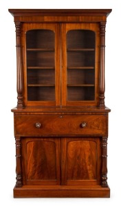 A Colonial Australian cedar secretaire bookcase with full turned columns, cock-beading, flame cedar panels, full cedar fitted interior and secondary timbers, New South Wales origin, circa 1855, 234cm high, 127cm wide,54cm deep