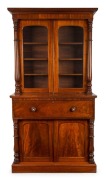 A Colonial&nbsp;Australian cedar&nbsp;secretaire bookcase with full turned columns, cock-beading, flame cedar panels, full cedar fitted interior and secondary timbers, New South Wales origin, circa 1855, 234cm high, 127cm wide,54cm deep