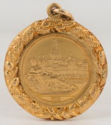 "The Exhibition Trustees" 18ct gold fob depicting the Melbourne Exhibition Buildings, and verso, engraved for "Alderman S.J. Morell, J.P. Appointed Trustee 9th Nov. 1926"; 17.8gms. - 2