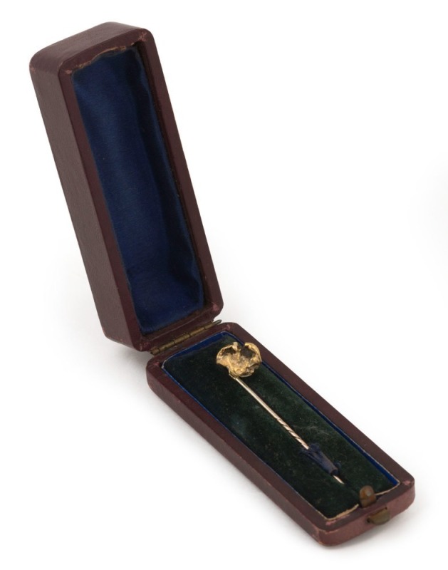 An antique Australian gold nugget specimen stickpin housed in a plush fitted box, 19th century, ​​​​​​​6.5cm long, 5.7 grams total