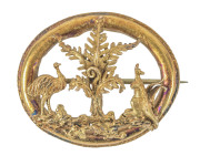 An Australian gold brooch with emu and kangaroo flanking a tree fern, most likely Sydney origin, 19th century, 4cm wide