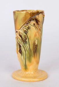 ERIC BRYCE CARTER yellow and brown glazed pottery vase with applied gumnuts and leaves, incised "E. Bryce Carter, Sydney", 14cm high