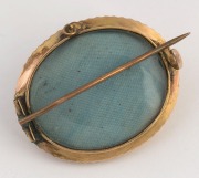 An antique oval yellow gold mourning brooch set with a turquoise, with mourning window on reverse, 19th century, ​​​​​​​3.5cm wide, 6.7 grams total - 2