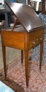 A Sheraton reading table, mahogany with ebony string inlay and bone escutcheon Finely crafted with tilting lid and original brass handles and castors, fitted accessory drawer to the right hand side, late 18th century. A rare and exceptional example. 74cm - 6