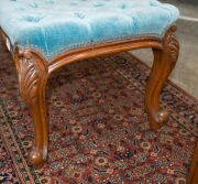 An antique English boudoir stool, carved walnut with blue velvet diamond upholstery, cabriole legs with scroll feet and original brass castors, mid 19th century, 49cm high, 80cm wide, 50cm deep - 4