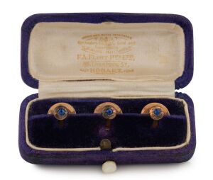 F.A. FLINT antique Australian 15ct gold stud set encrusted with blue sapphires in original banded plush fitted box marked "F.A. FLINT, 116 Liverpool Street, HOBART", 19th century, stamped "A.F. FLINT 15ct", the box 6.5cm wide