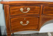 A George III Hepplewhite mahogany sideboard with string inlay and cross banding, finely crafted serpentine front with square form tapering legs, double fronted cellarette drawer to the left hand side, original brass drop handles with attractive reed decor - 7