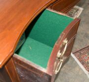 A George III Hepplewhite mahogany sideboard with string inlay and cross banding, finely crafted serpentine front with square form tapering legs, double fronted cellarette drawer to the left hand side, original brass drop handles with attractive reed decor - 9