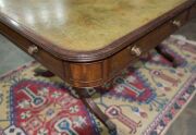 A George III English mahogany library table with embossed green leather top, attractive rounded corners with two drawers and four simulated drawer fronts to the ends and sides, supported on two double concave reeded trestles forming attractive splay legs - 12