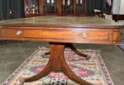 A George III English mahogany library table with embossed green leather top, attractive rounded corners with two drawers and four simulated drawer fronts to the ends and sides, supported on two double concave reeded trestles forming attractive splay legs - 13