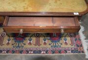 A George III English mahogany library table with embossed green leather top, attractive rounded corners with two drawers and four simulated drawer fronts to the ends and sides, supported on two double concave reeded trestles forming attractive splay legs - 10