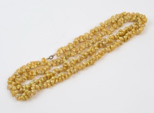Tasmanian shell bead necklace, intricately threaded with iridescent shell specimens. A fine example. 125cm long