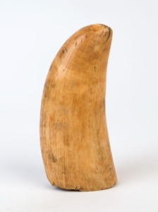 An antique sperm whale tooth with rich 19th century patination, 12cm high
