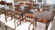 GILLOWS Georgian mahogany extension dining table with fold-over top and concertina undercarriage, eight turned and tapered gun barrel legs with original brass castors, accompanied by mahogany extension leaf holder and four extension leaves, circa 1810, 75 - 11