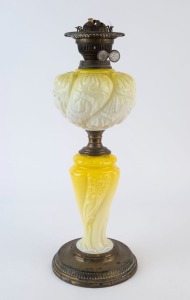 An antique kerosene lamp with duplex white double button burner, embossed lemon glass font and column with brass base, 19th century, ​​​​​​​51cm high overall