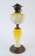 An antique kerosene lamp with duplex white double button burner, embossed lemon glass font and column with brass base, 19th century, ​​​​​​​51cm high overall