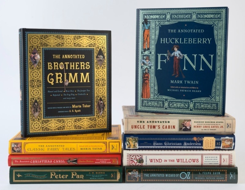 A collection of "The Annotated..." series published by W.W. Norton & Co., including 'Wind in the Willows', 'Huckleberry Finn', 'Wizard of Oz', 'Uncle Tom's Cabin', 'Hans Christian Andersen', and four others; all hardcover with dustjackets, "as new". (9 vo