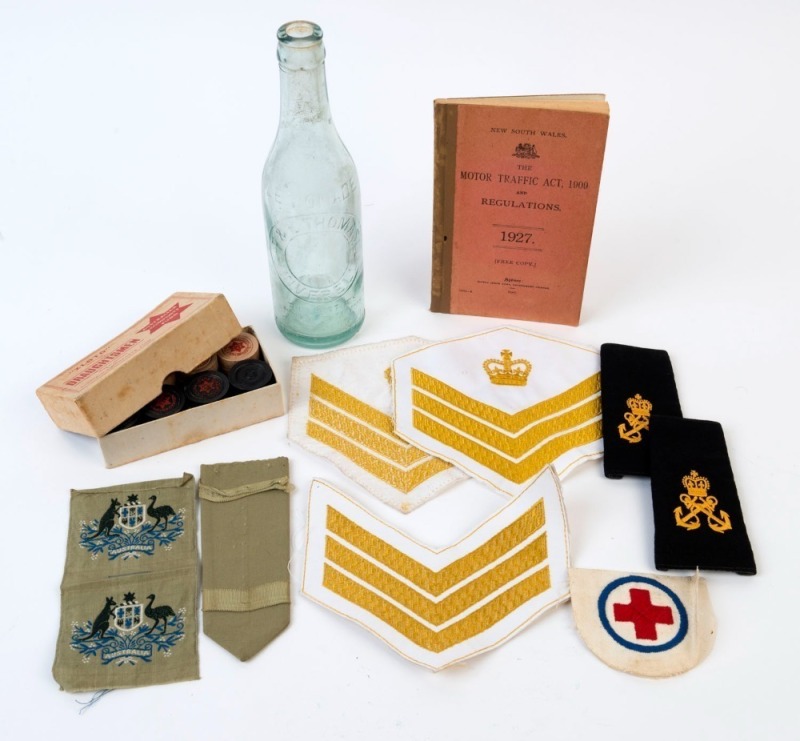 "ZLOTO" Australian Comforts Fund, DRAUGHTSMEN set in original box; together with a "Motor Traffic Act, 1909, And Regulations" 1927 edition; a lemonade bottle stamped "F. & E. THOMAS Ltd. INVERELL", plus 8 assorted military patches, (11 items) ​​​​​​​the b