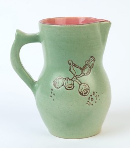 SADIE KENNEDY green and pink glazed pottery jug with sgraffito gumnut decoration, incised "S. Kennedy", ​​​​​​​15.5cm high