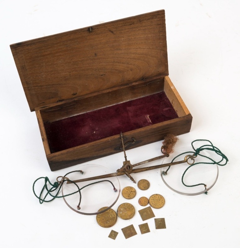 Antique gold scales in timber box with glass pans and attractive set of weights, 19th century, the box 18cm wide. PROVENANCE: Private Collection Bendigo