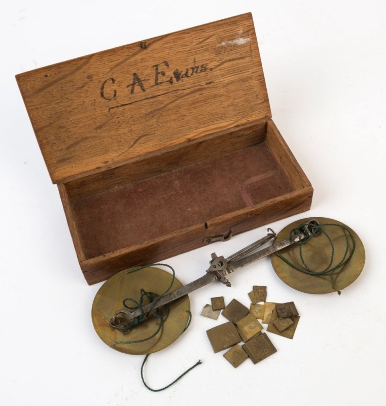 Antique gold scales in oak case with brass pans and square weights, 19th century, ownership inscription inside lid "C.A. Evans", the box 17cm wide. PROVENANCE: Private Collection Bendigo