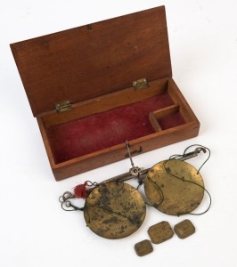 Antique gold scales in mahogany case with brass pans and three lozenge weights, 19th century, the box 17.5cm wide. PROVENANCE: Private Collection Bendigo