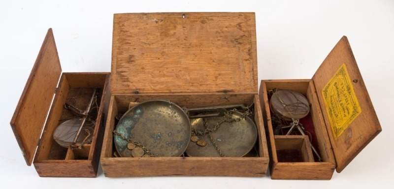 Three antique gold scales in timber cases, 19th century, the largest 22.5cm wide. PROVENANCE: Private Collection Bendigo