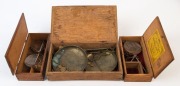 Three antique gold scales in timber cases, 19th century, the largest 22.5cm wide. PROVENANCE: Private Collection Bendigo