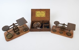 Three assorted gold scales and weights, 19th century, the largest 21cm wide
