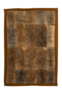 An antique kangaroo skin rug with felt backing, embroidered monogrammed verso "G.O.S.", late 19th century, ​202cm x 142cm