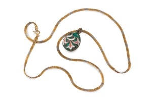 A Russian gold and enamel Easter egg pendant on a two tone 14ct gold flat weave chain, 20th century, the egg 1.6cm high, the chain 46cm long, 9.7 grams total