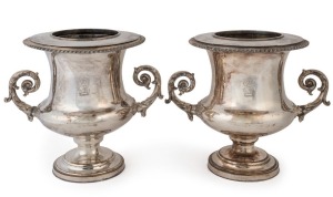 A pair of antique silver plated champagne ice buckets with engraved crest, stamped "Cowie & Co. Long Acre", 25cm high, 28cm wide