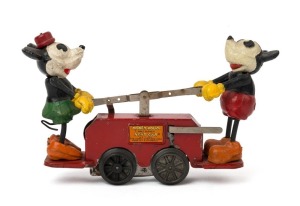 MICKEY & MINNIE MOUSE: wind-up Hand Car (Model No, 1100, with key), made by The Lionel Corp (New York); in good original condition (Mickey missing tail); length 26cm, height 15cm.