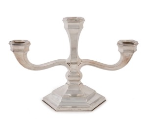 A German Art Deco three branch candelabra by H.M. Wilkens & Sohns, circa 1930, stamped "H.M. Wilkens & Sohns, 835", 19cm high, 28cm wide, weighted base.