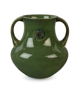 MOORCROFT "Flamminian" ware green glazed pottery vase with foliate roundel and two handles, circa 1905-1915, impressed mark "Moorcroft, Burslem" with green underglaze signature "W. Moorcroft", 20.5cm high